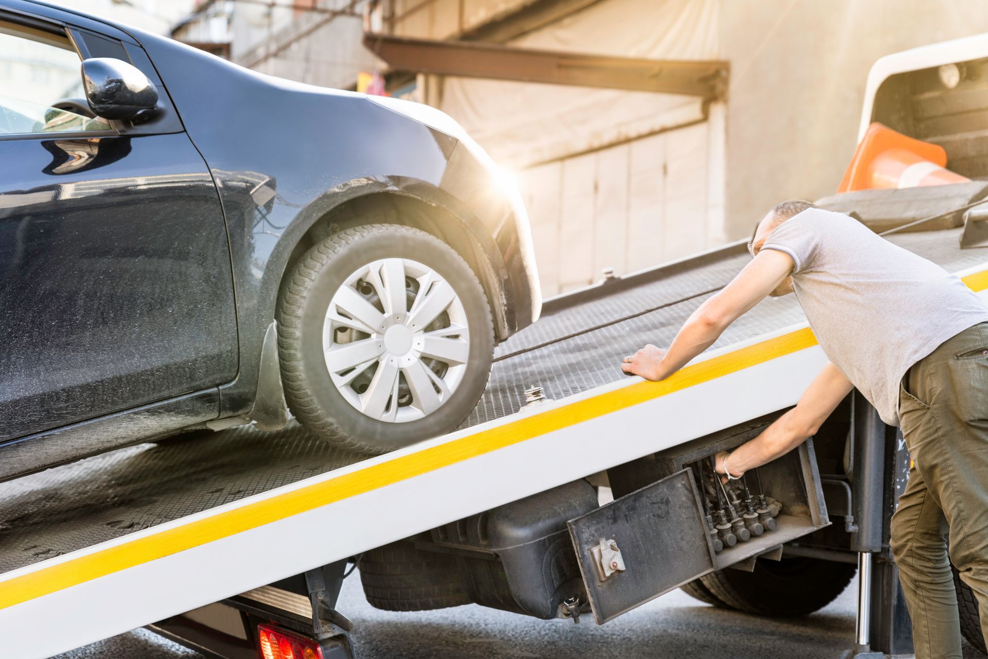 Car loaded onto a tow truck.