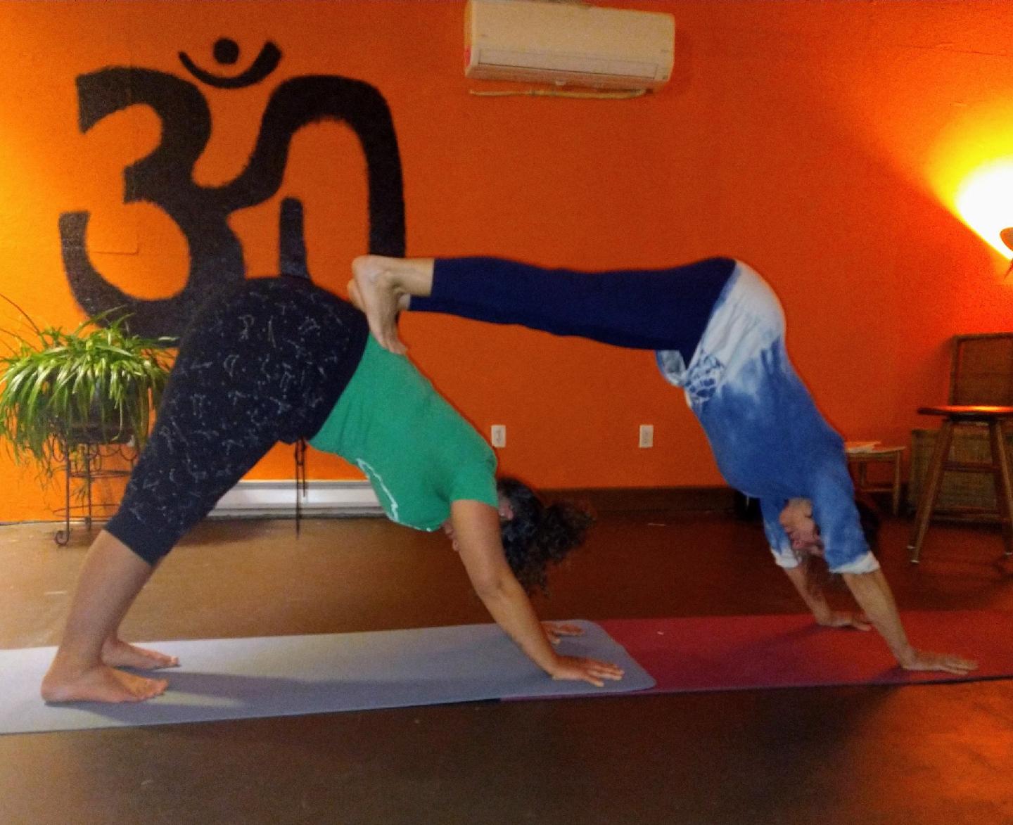 2 women doing yoga