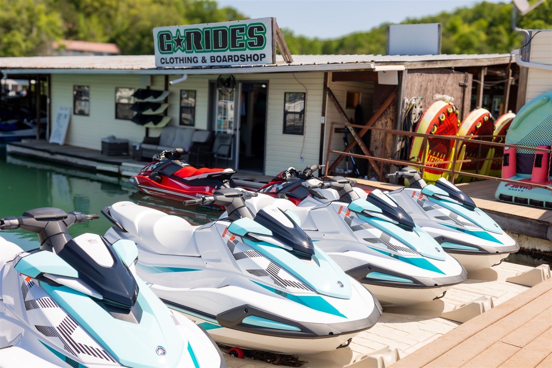 Jet skis are parked in front of a store