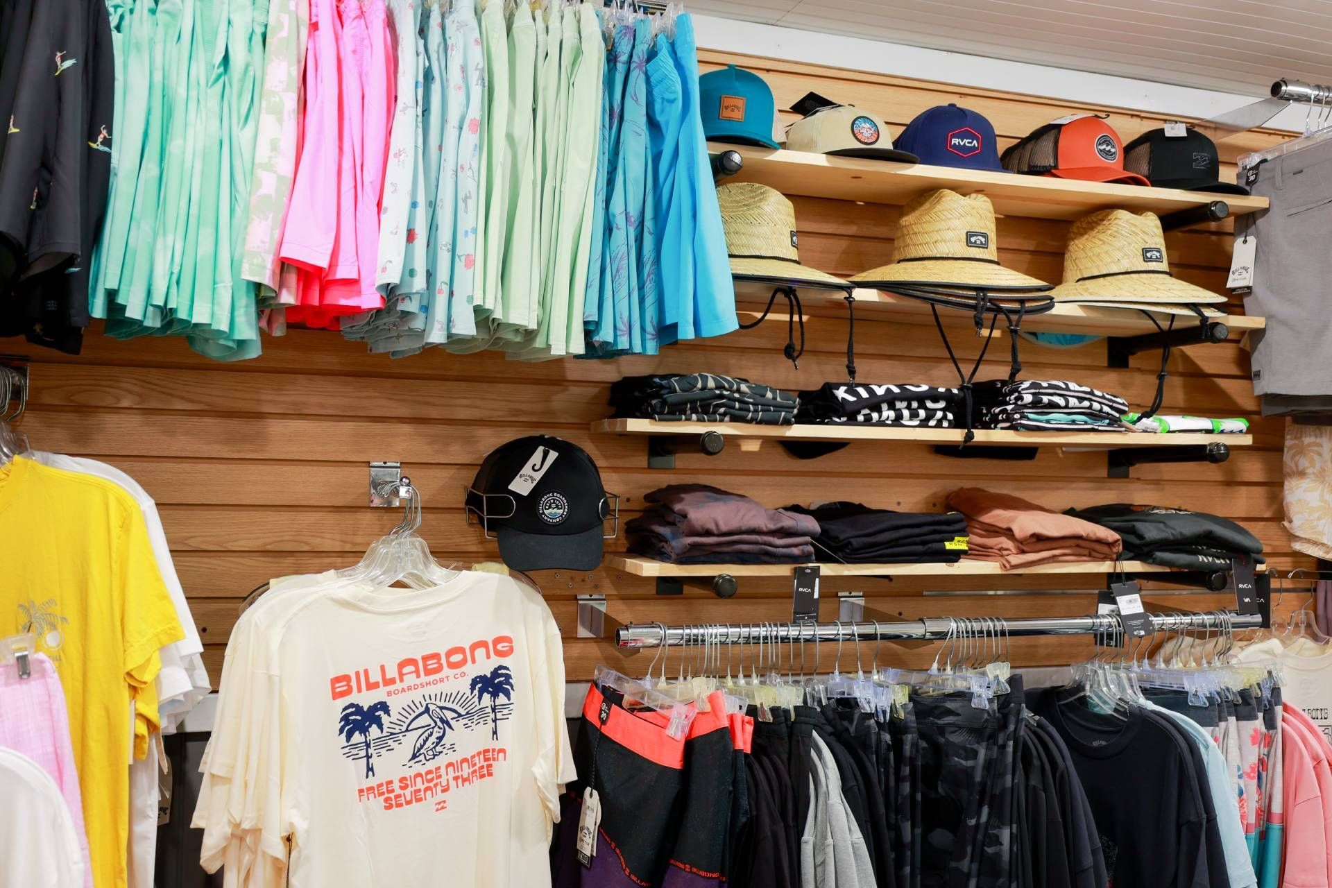 A billabong shirt hangs on a rack in a store