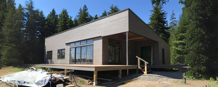 A house is being built in the middle of a forest.