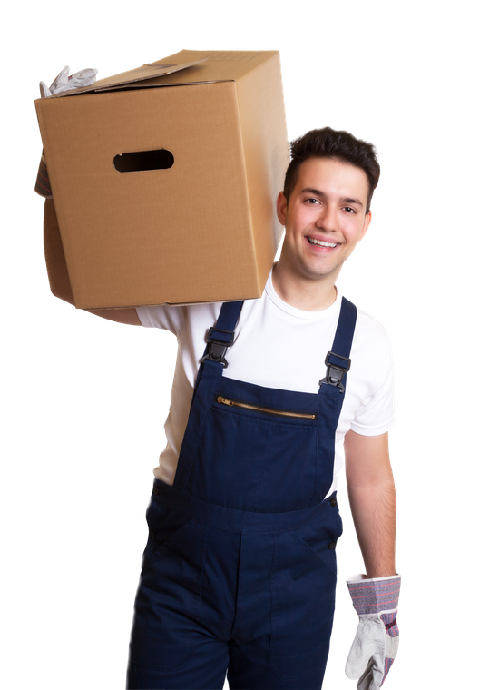 A man in blue overalls is carrying a cardboard box on his shoulder.