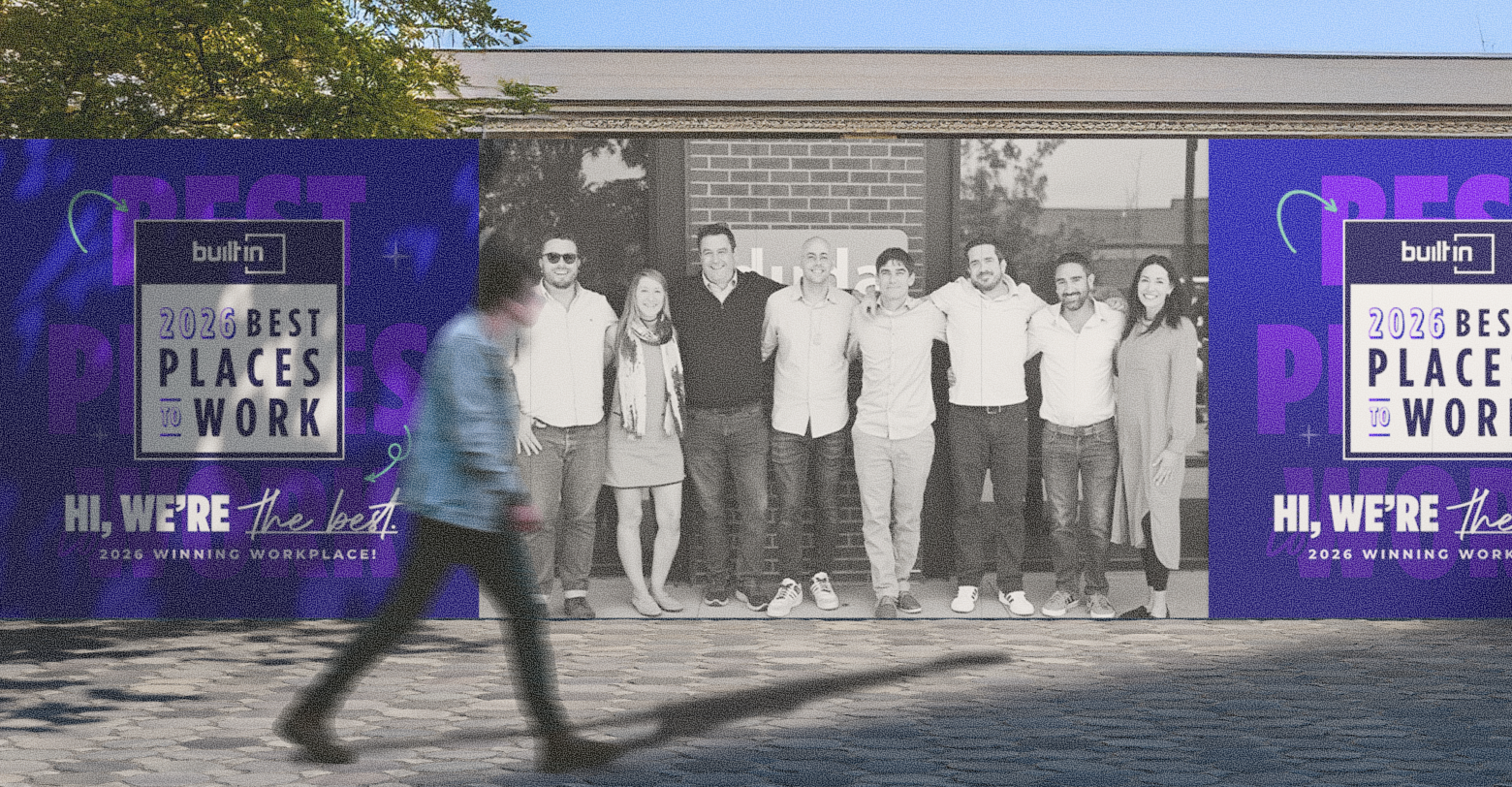 A man walks past a group of people and a 