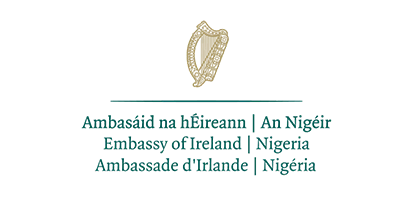 The logo of the Embassy of Ireland in Nigeria featuring the Irish harp emblem above the embassy's name in three languages.