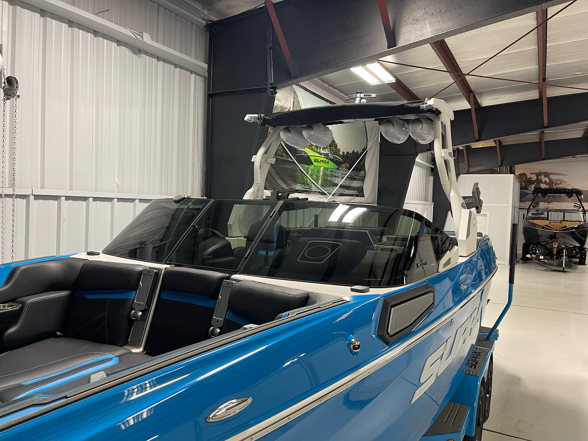 Blue and white boat inside a building.
