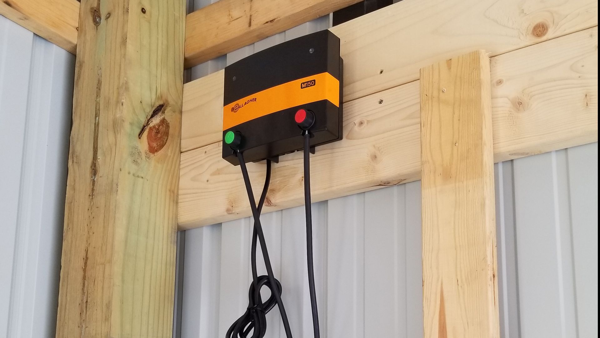 Gallagher M150 Attached To A Wall With Wires - Columbus, IN - Indiana Agricultural Fencing