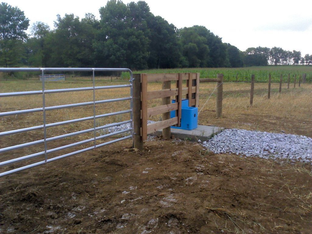 Metal Gate With A Blue Water Bottle Placed Beside It - Columbus, IN - Indiana Agricultural Fencing