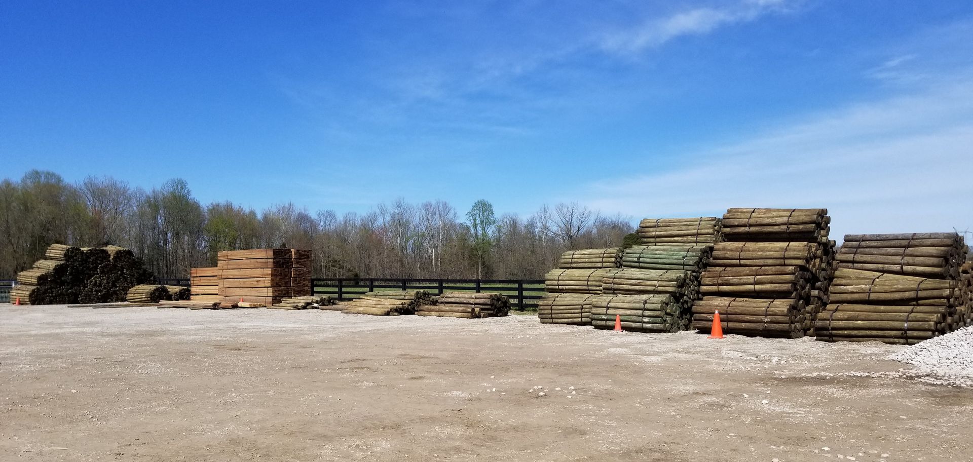 Stack Of Wood On Dirt Ready For Use - Columbus, IN - Indiana Agricultural Fencing