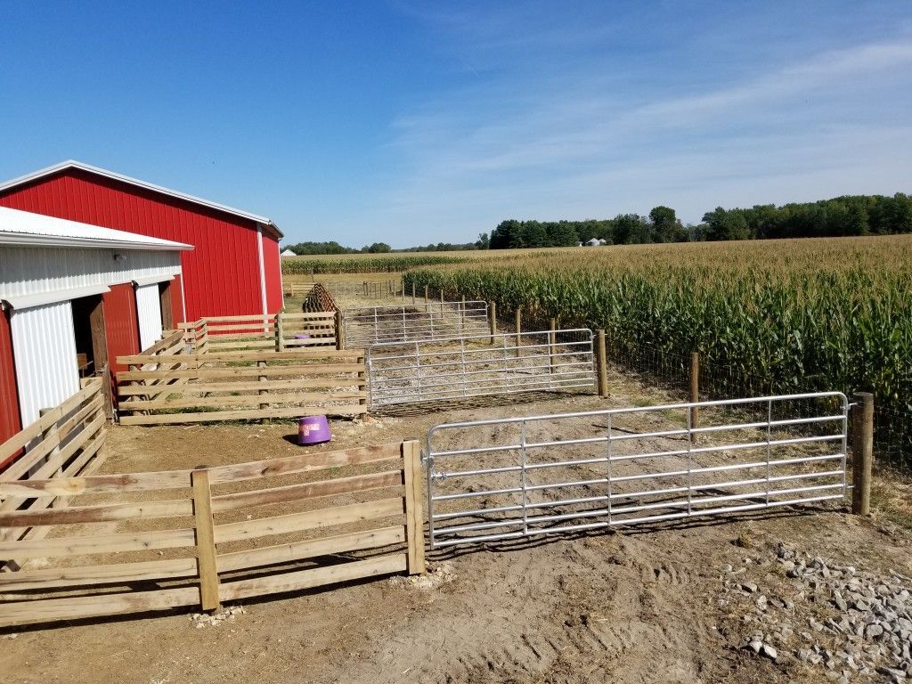 Charming Red Barn Enclosed By A Fence And A Gate - Columbus, IN - Indiana Agricultural Fencing