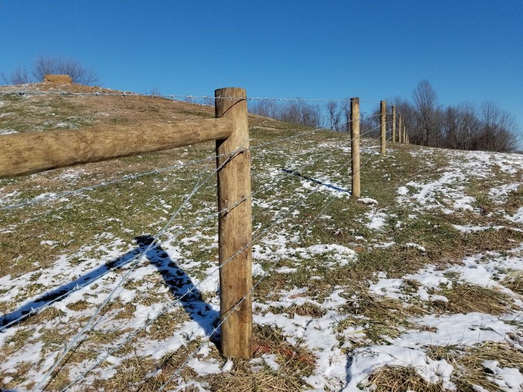 Snow-Covered Hillside With A Fence - Columbus, IN - Indiana Agricultural Fencing