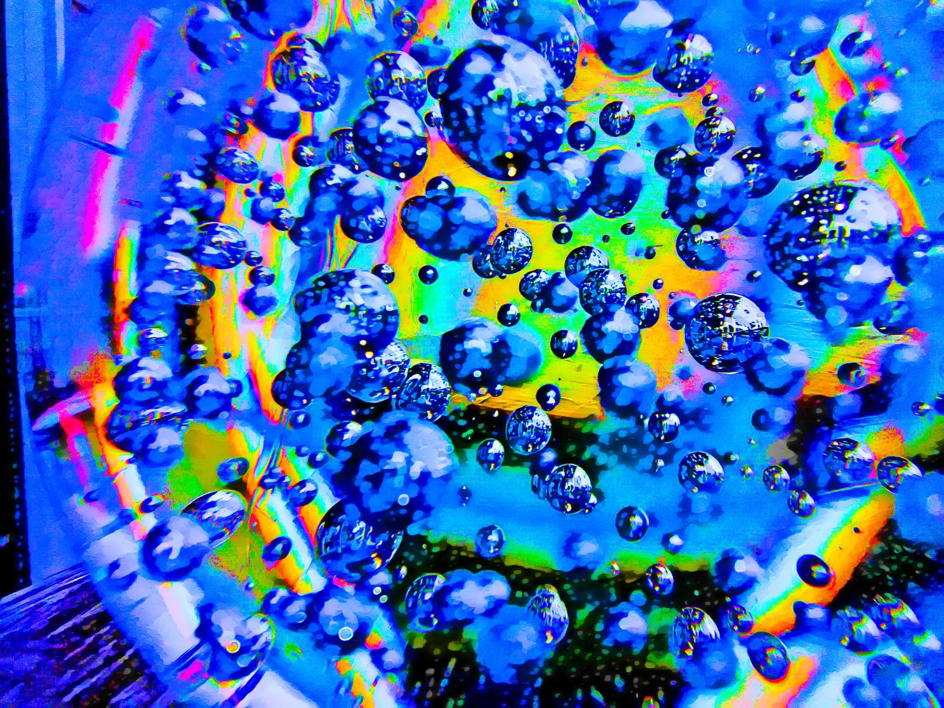 A colorful painting of bubbles in a glass of water.