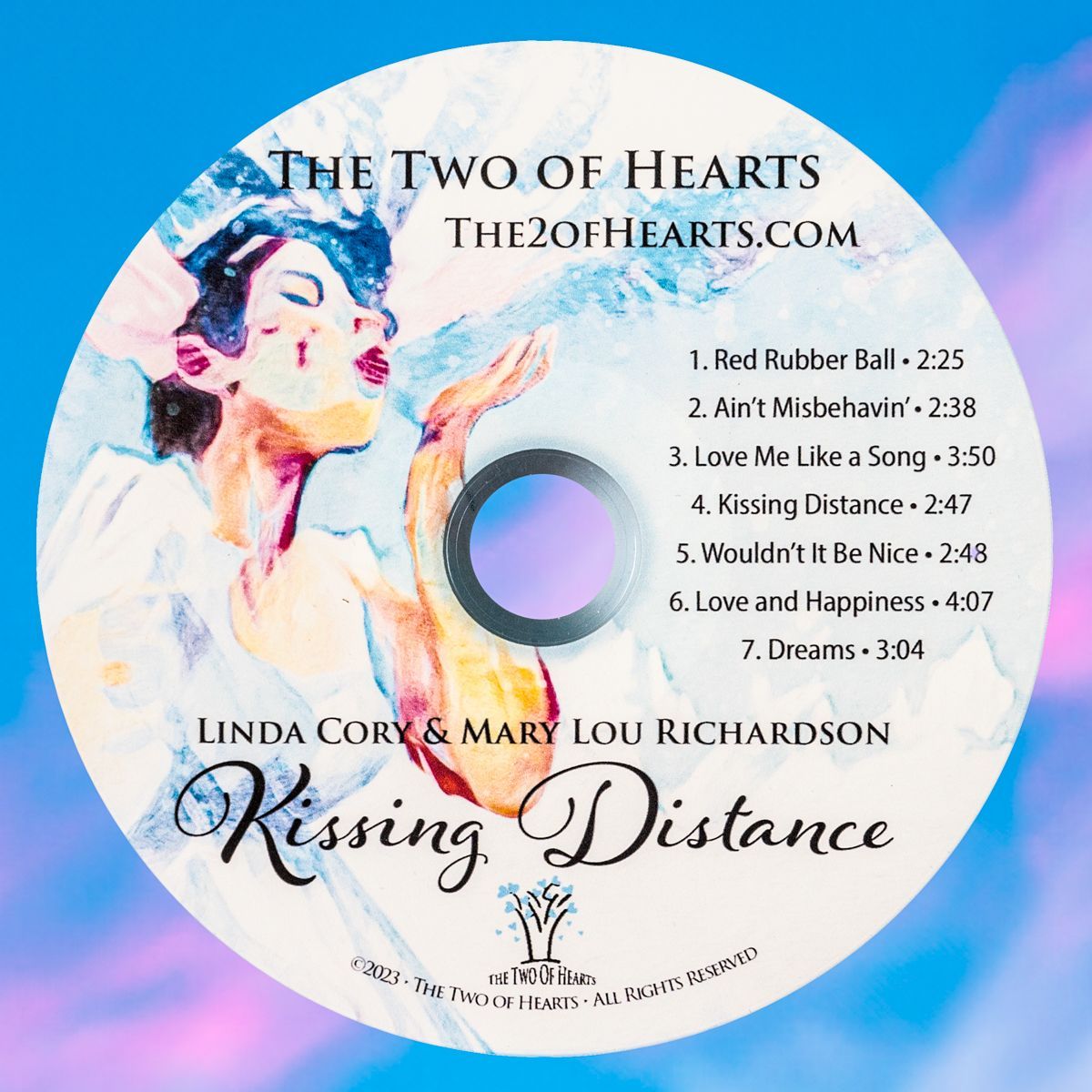 a cd label for the two of hearts kissing distance