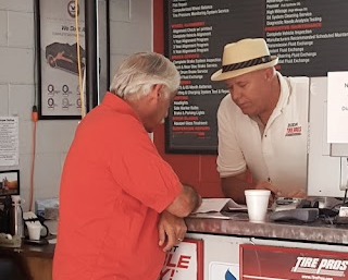 shop owner helping customer | Dixon Tire Pros & Auto Repair