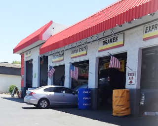 shop front with bay doors open | Dixon Tire Pros & Auto Repair