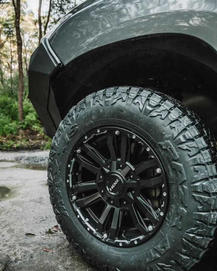 A Close Up of a Tire on a Black Truck — Nationwide Auto Service Centre in West Gosford, NSW