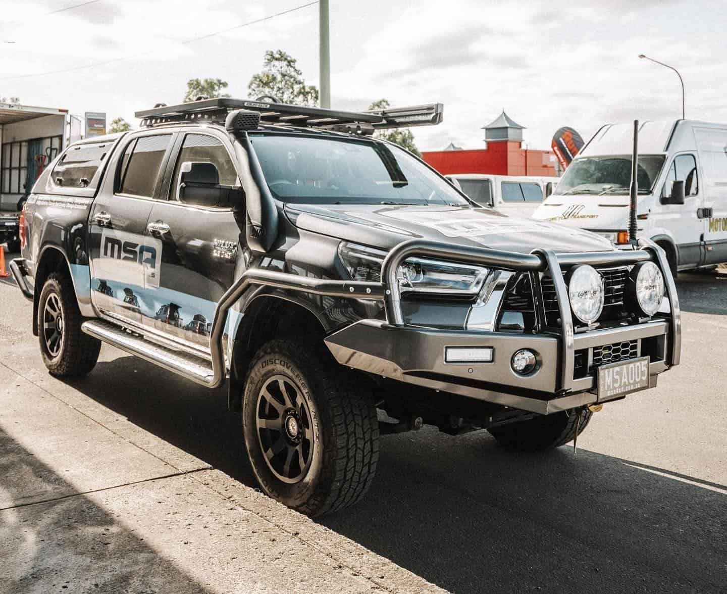 A Black Truck is Parked on the Side of the Road — Nationwide Auto Service Centre in West Gosford, NSW