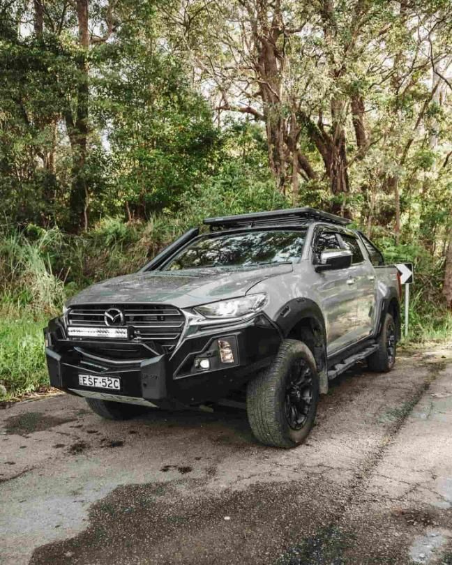 A Gray Truck is Parked on the Side of a Road in the Woods — Nationwide Auto Service Centre in West Gosford, NSW