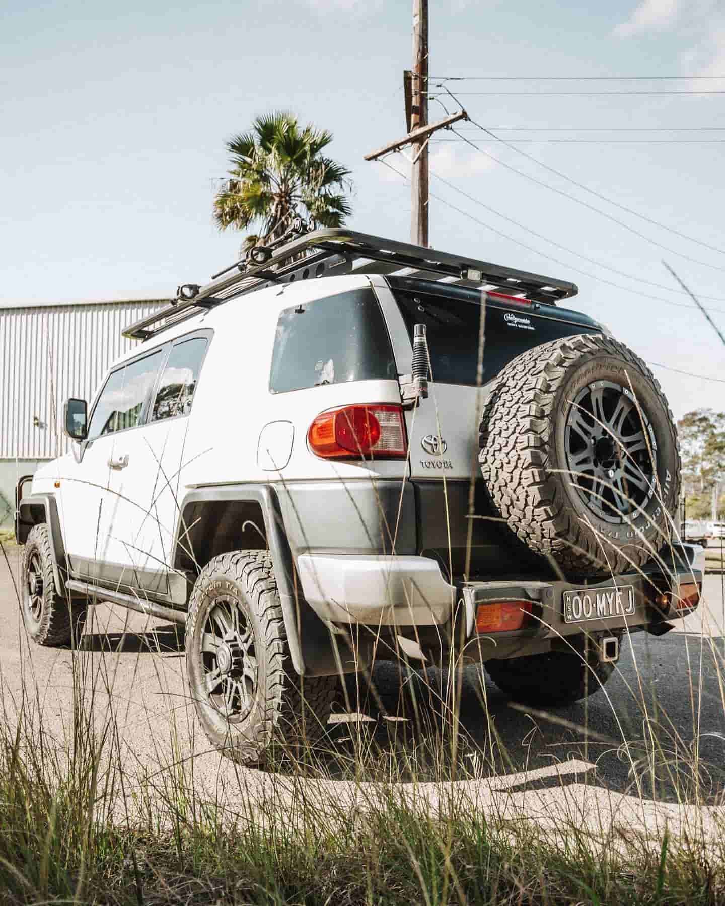 A White Toyota FJ Cruiser is Parked on the Side of a Dirt Road — Nationwide Auto Service Centre in West Gosford, NSW