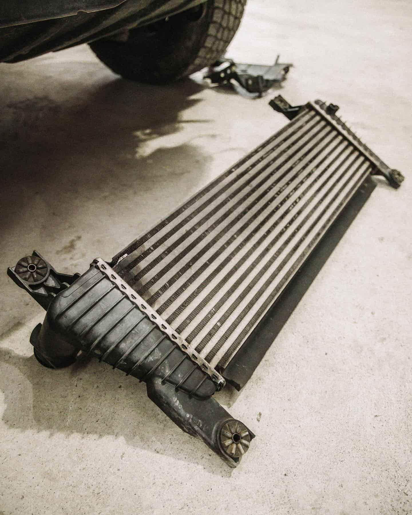 A Radiator is Laying on the Ground Under a Car — Nationwide Auto Service Centre in West Gosford, NSW