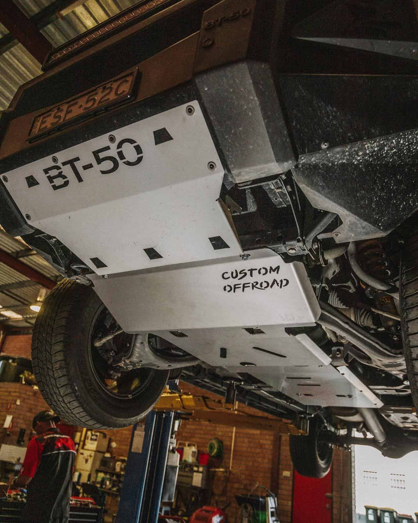 A Car is Sitting on a Lift in a Garage — Nationwide Auto Service Centre in West Gosford, NSW