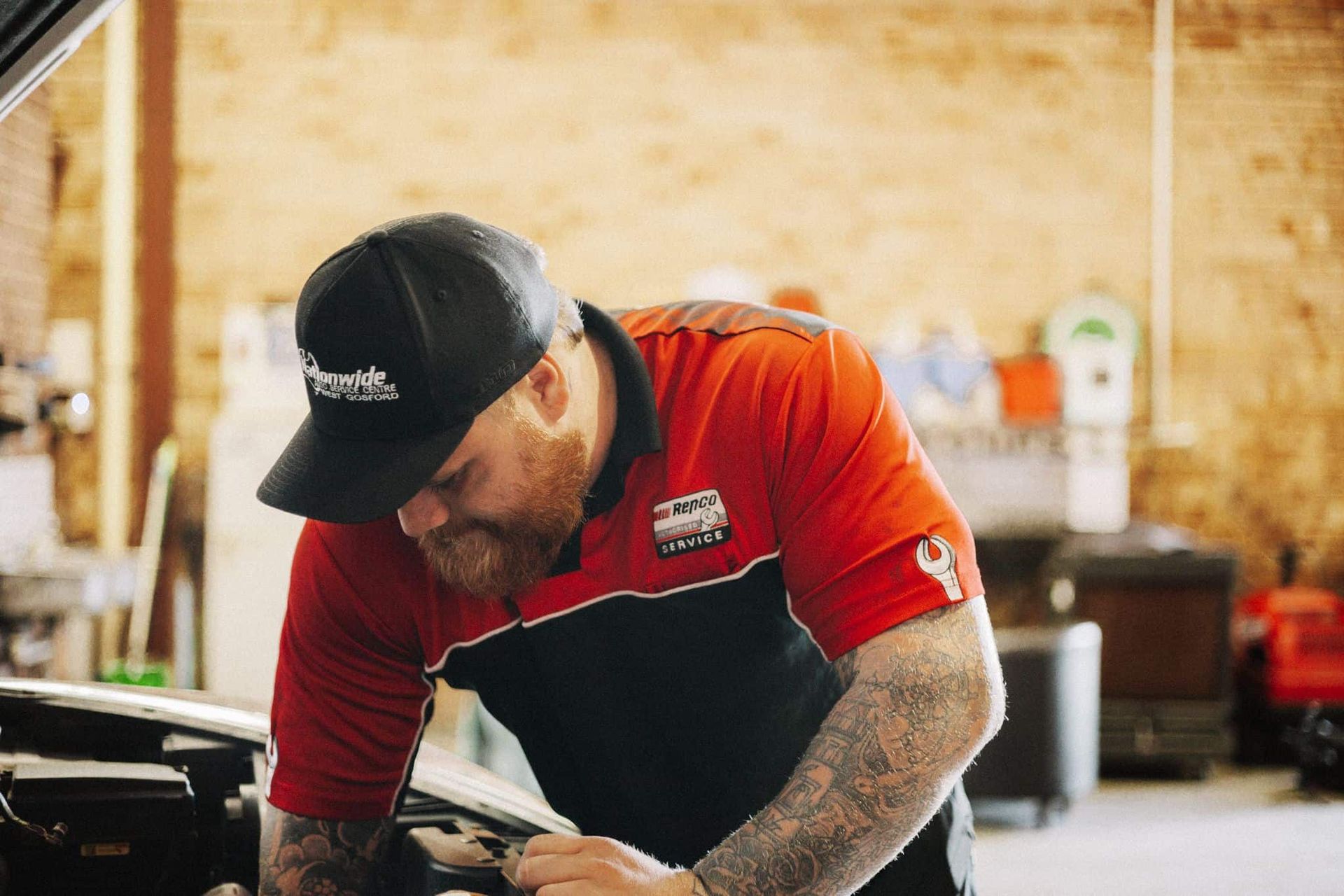 A Man is Working on a Car in a Garage — Nationwide Auto Service Centre in West Gosford, NSW