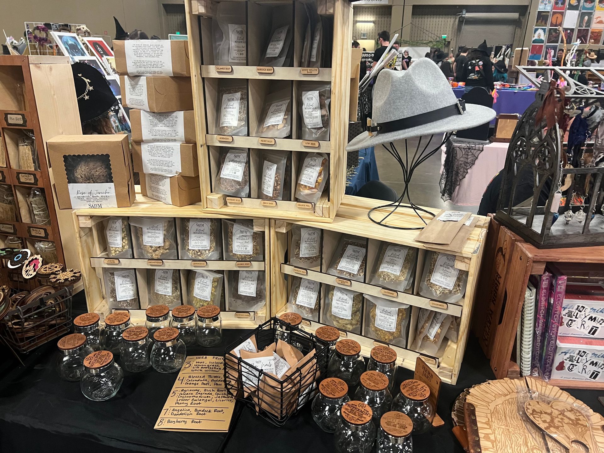 A table with a lot of jars and boxes on it.