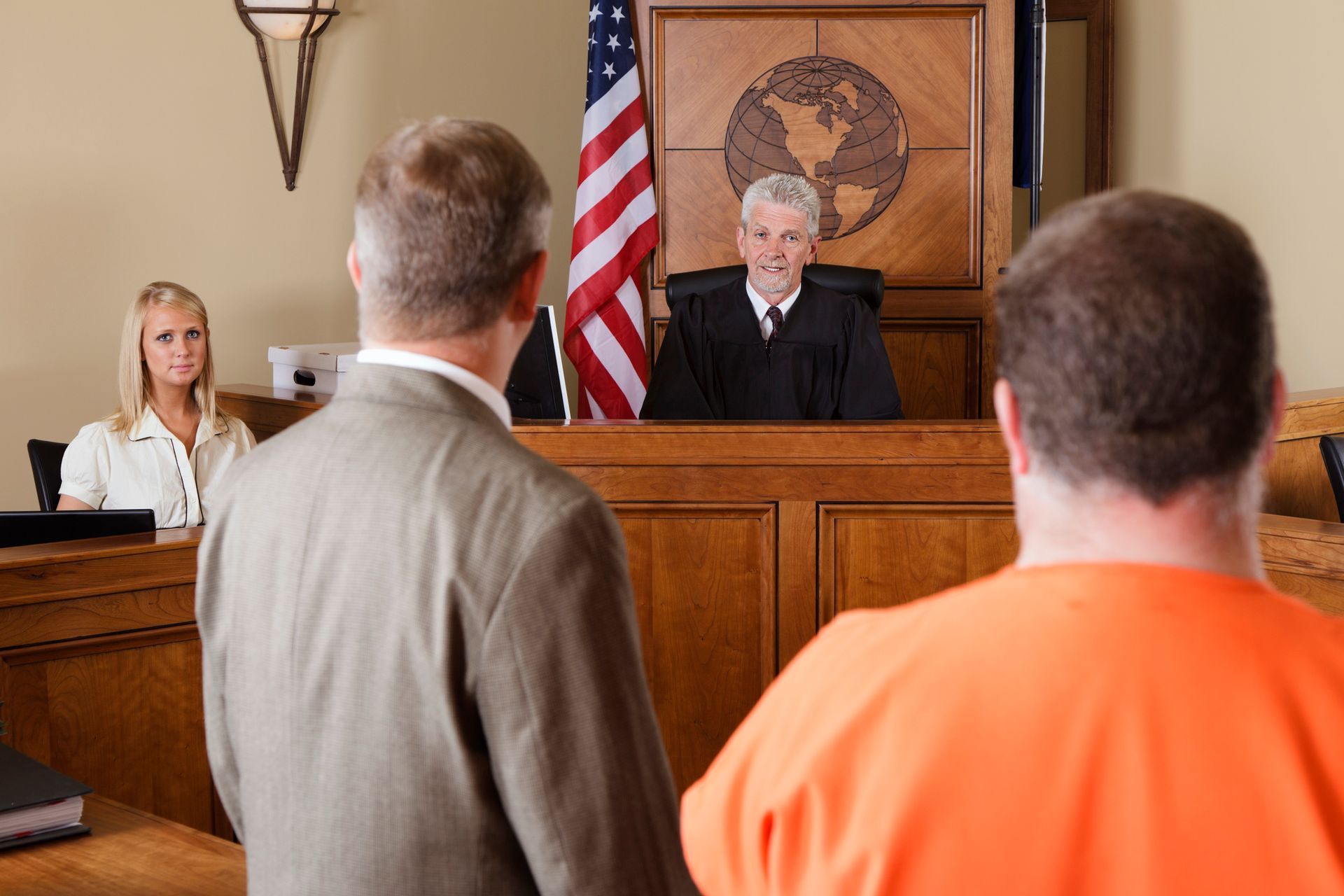 Criminal defense trial attorney representing his client in court.