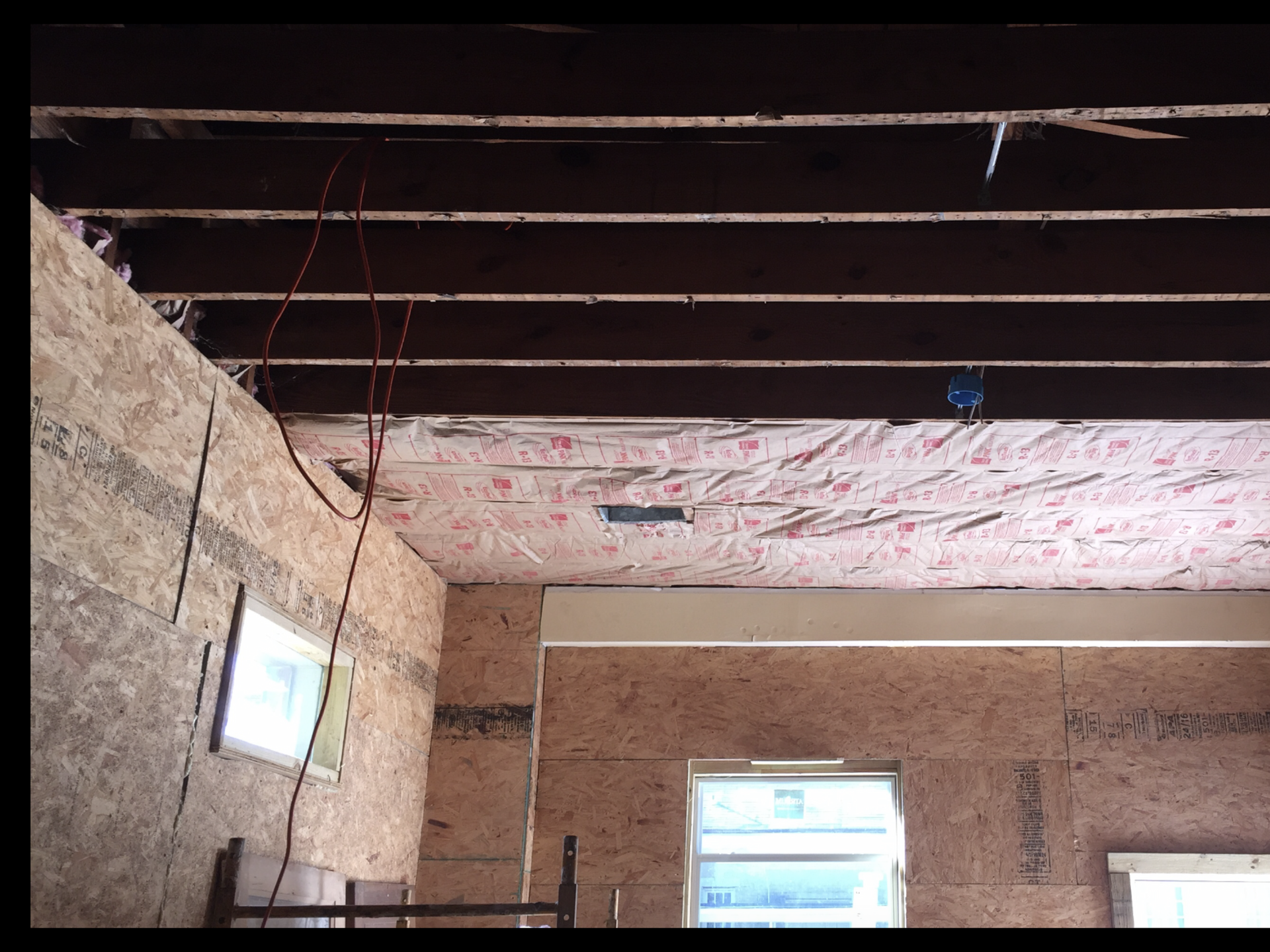 A room with a ceiling that has the word north on it