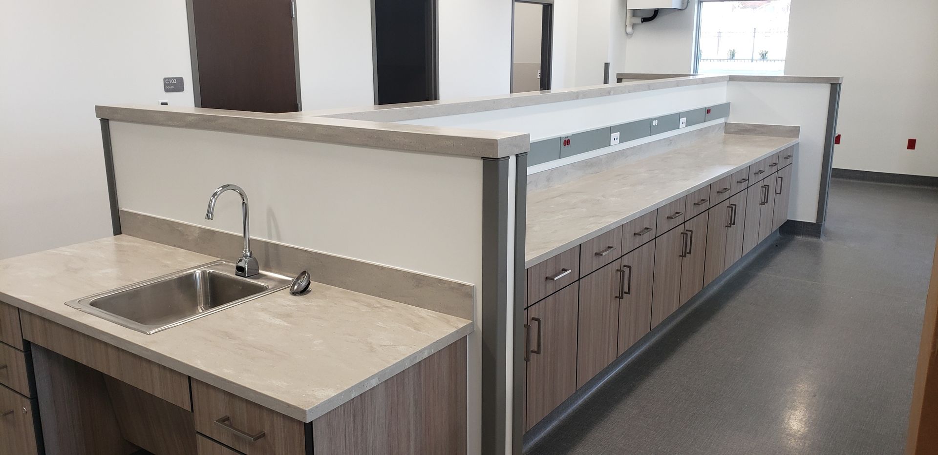 There is a sink in the middle of the room.