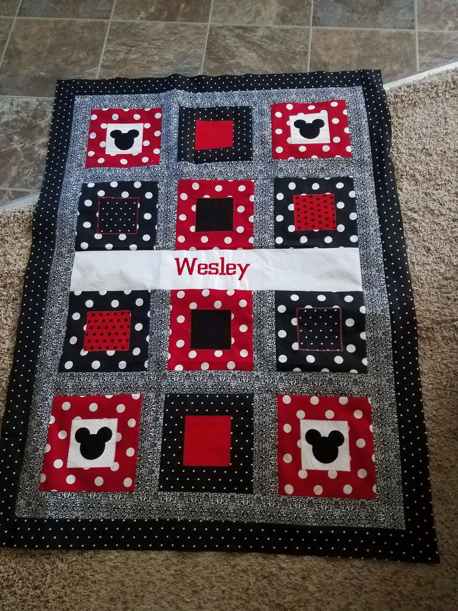 A quilt with the name wesley on it