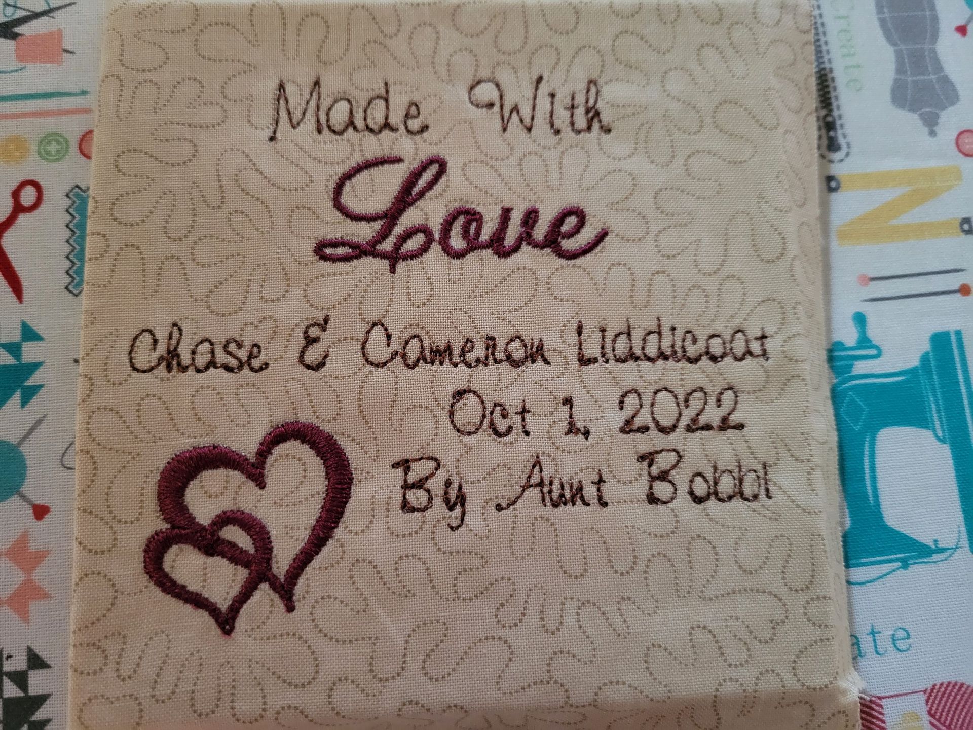 A piece of fabric with the words `` made with love '' embroidered on it