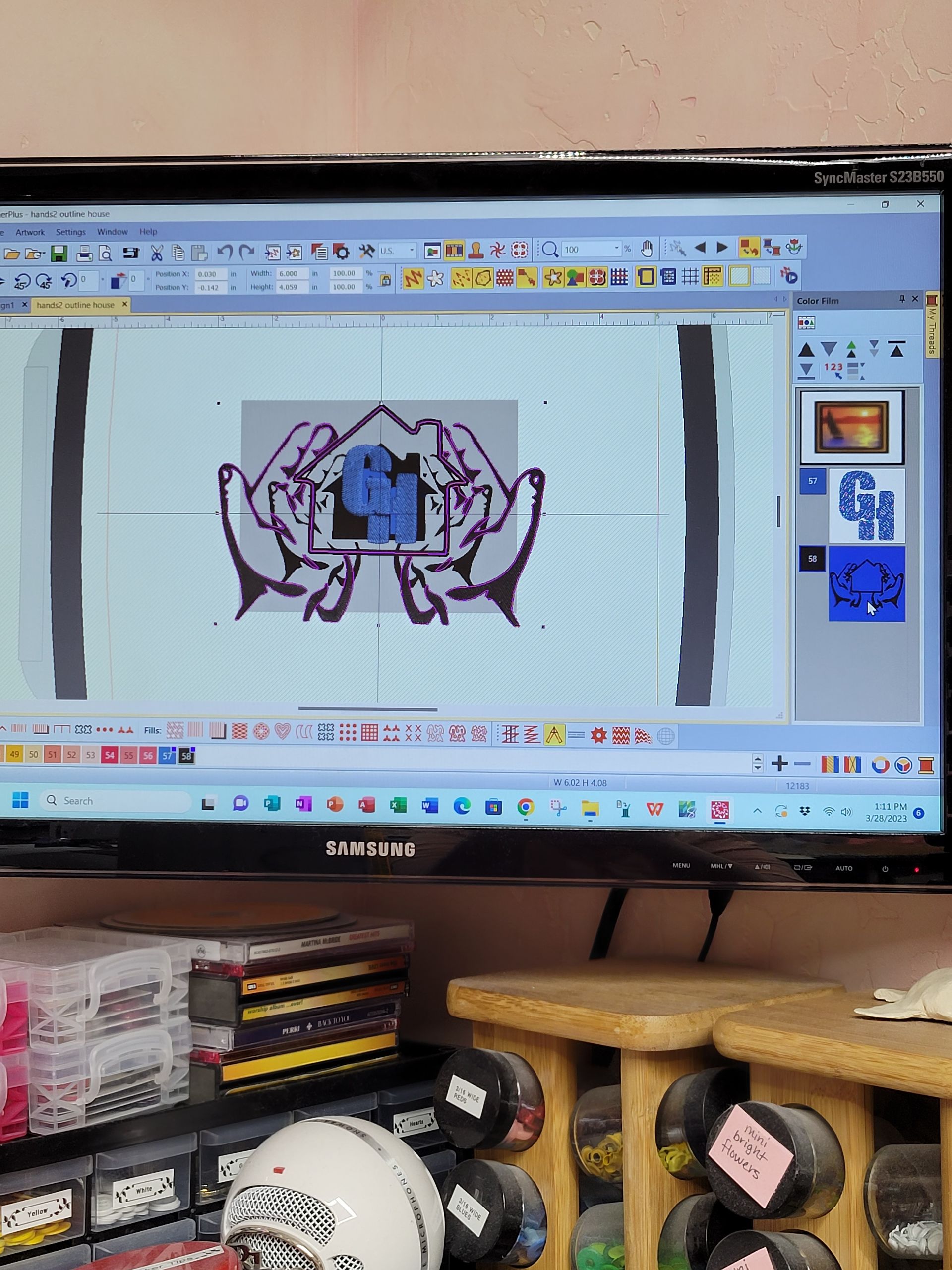 A computer monitor with a picture of hands on it