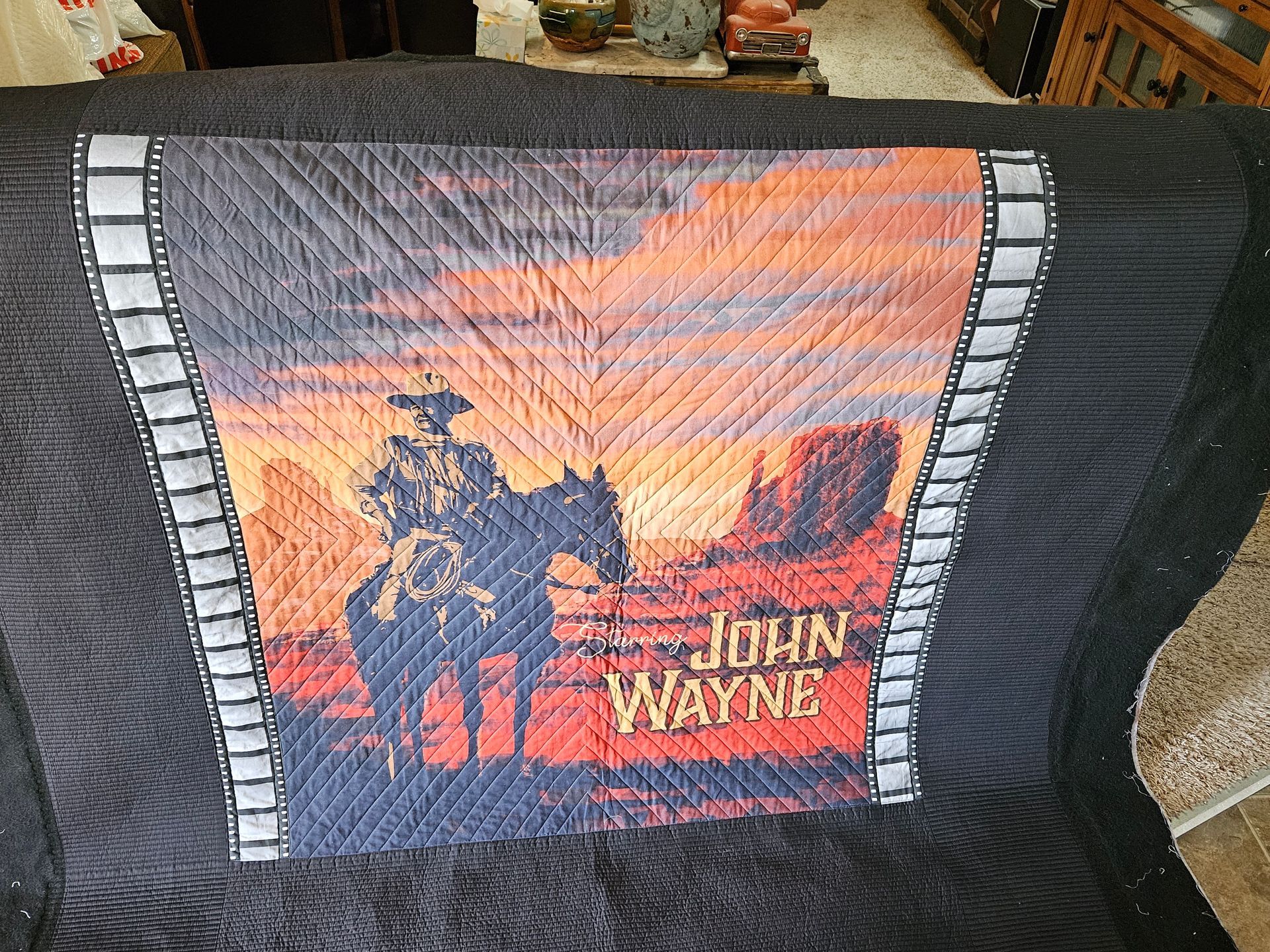A quilt with a picture of john wayne on it