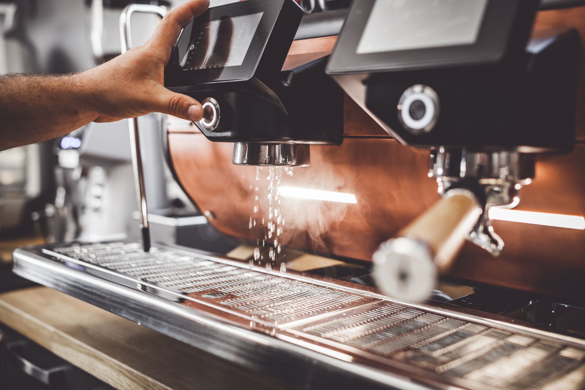 Person Operating an Espresso Machine — Memories Cafe @ Yorkeys Knob in Yorkeys Knob, QLD