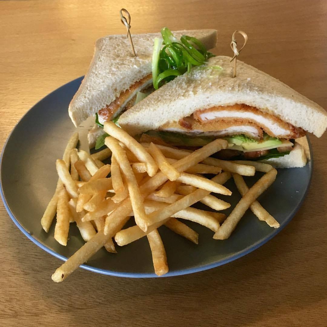 A sandwich and french fries on a plate on a table — Memories Cafe At Yorkeys Knob
