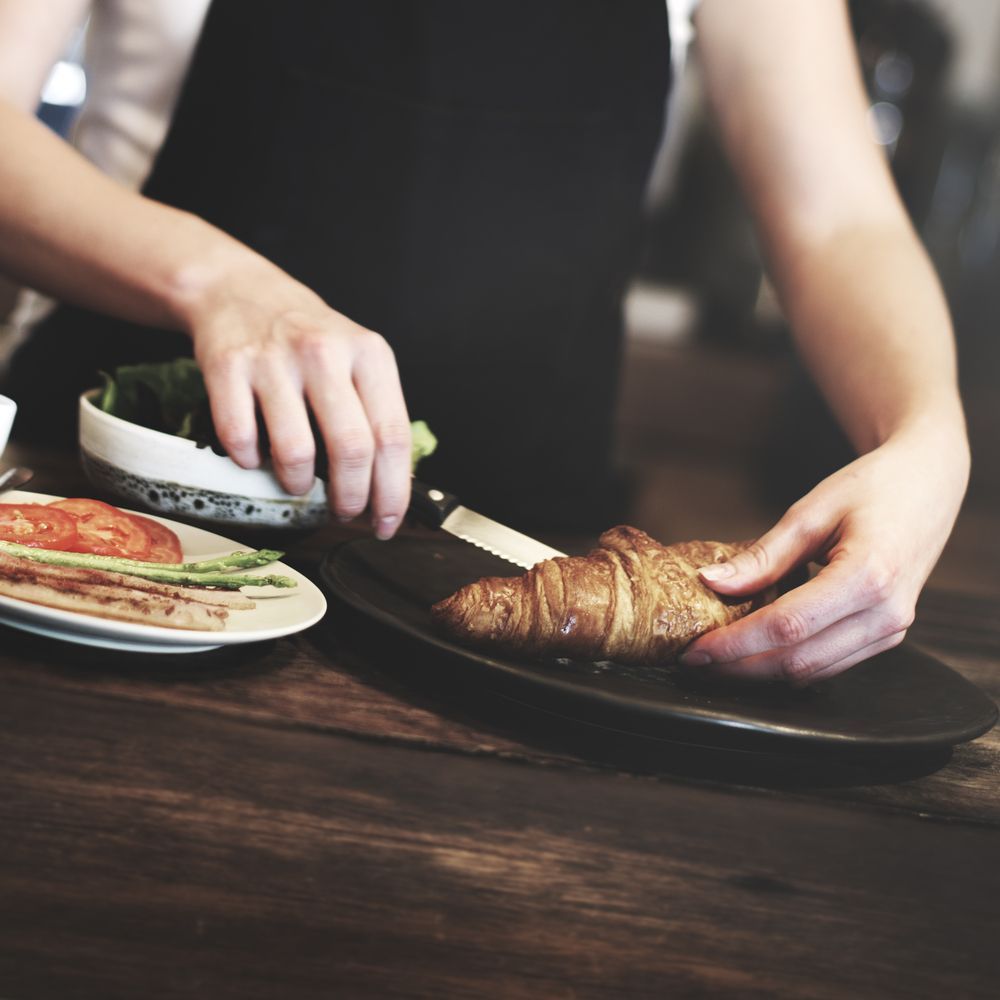 A Cup of Coffee on a Saucer With a Spoon — Memories Cafe At Yorkeys Knob