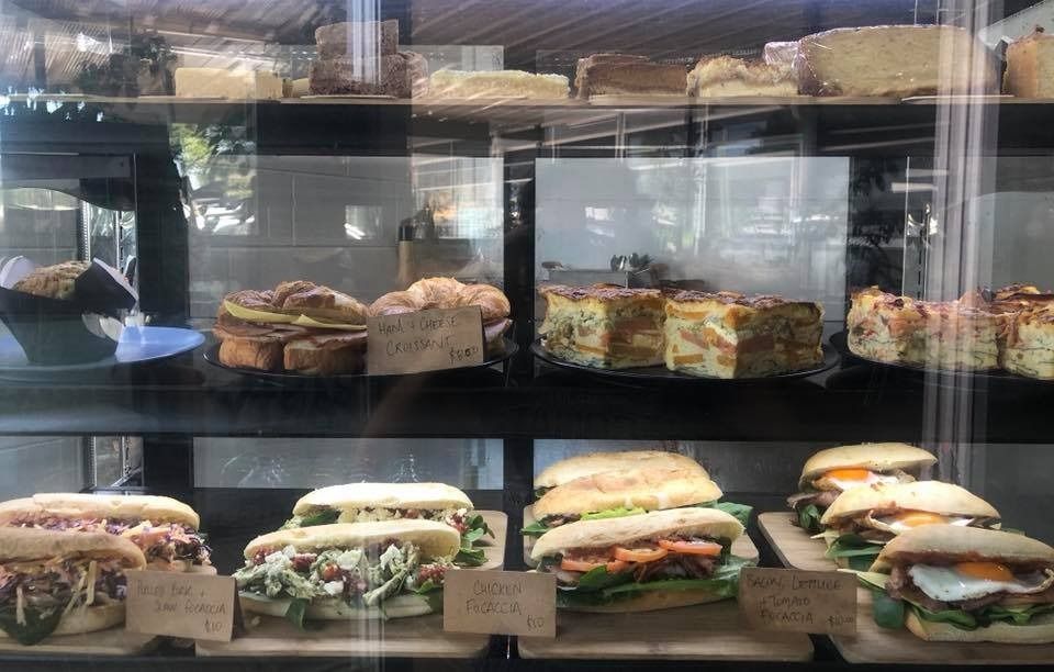 A Display Case Filled With a Variety of Sandwiches And Pastries — Memories Cafe At Yorkeys Knob