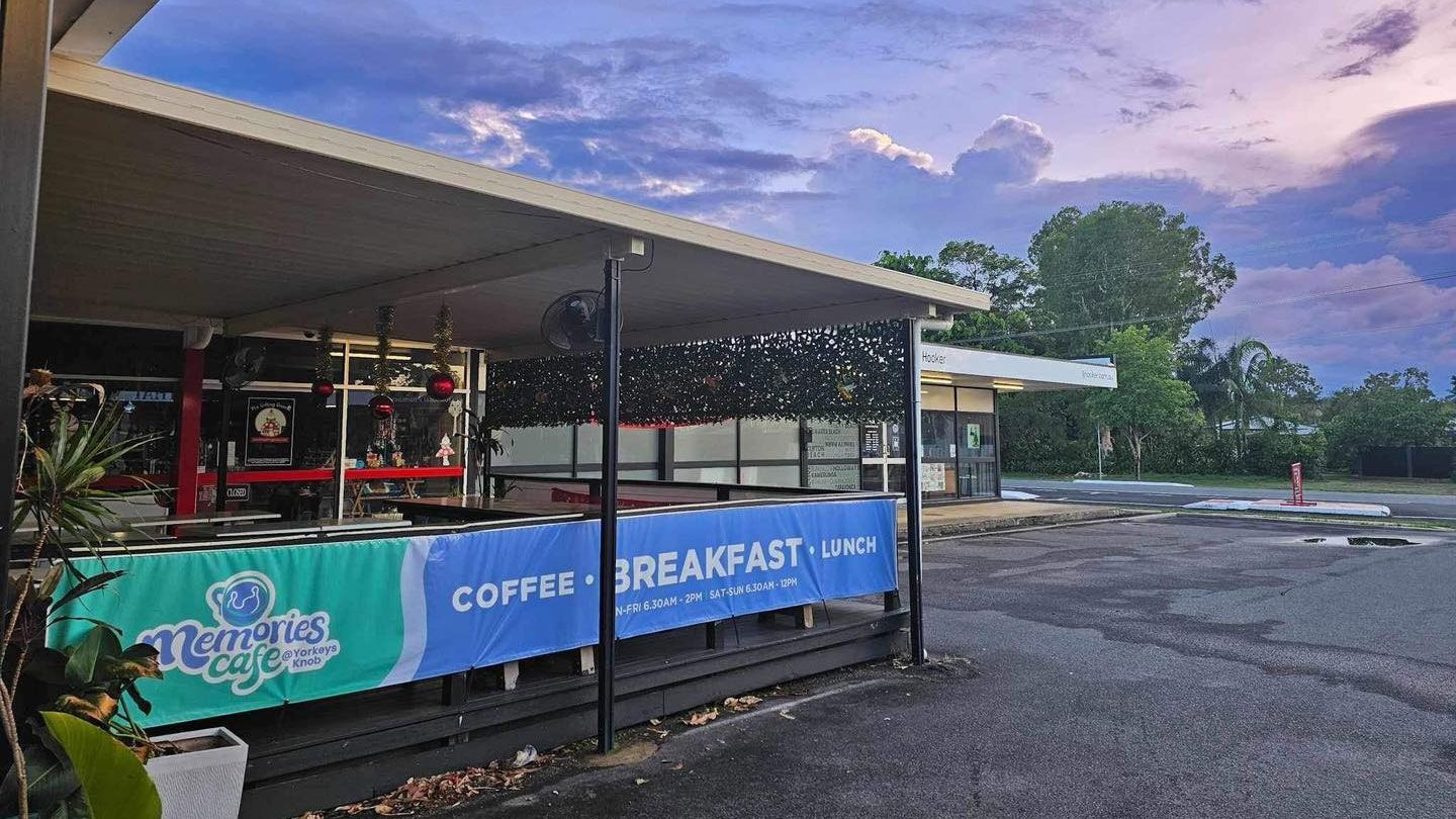 A Group of People Are Playing Instruments in a Cafe — Memories Cafe At Yorkeys Knob