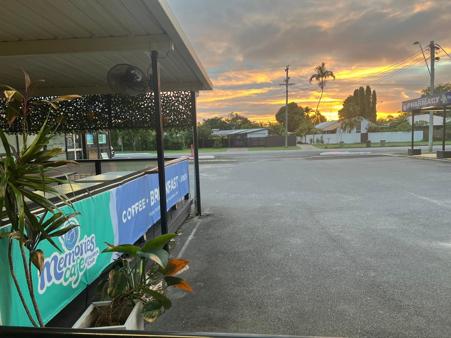 A Group of People Are Sitting Outside of a Cafe — Memories Cafe At Yorkeys Knob