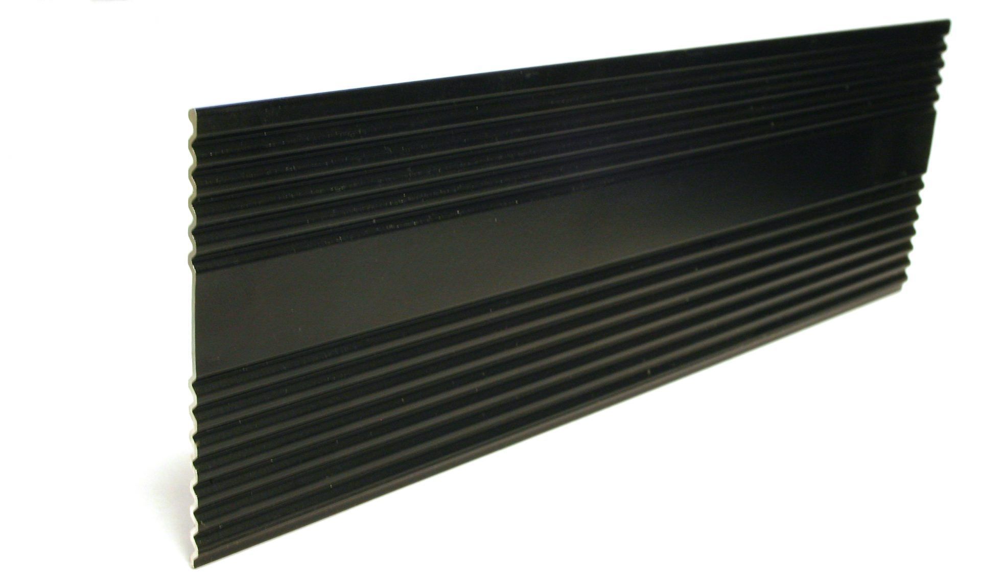 Black aluminum baseboard with horizontal ridges.