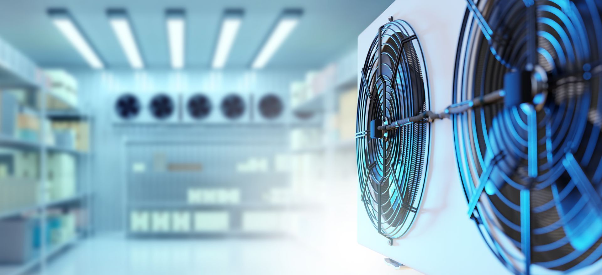 Close-up of industrial cooling fans in a bright, modern warehouse or cold storage facility.