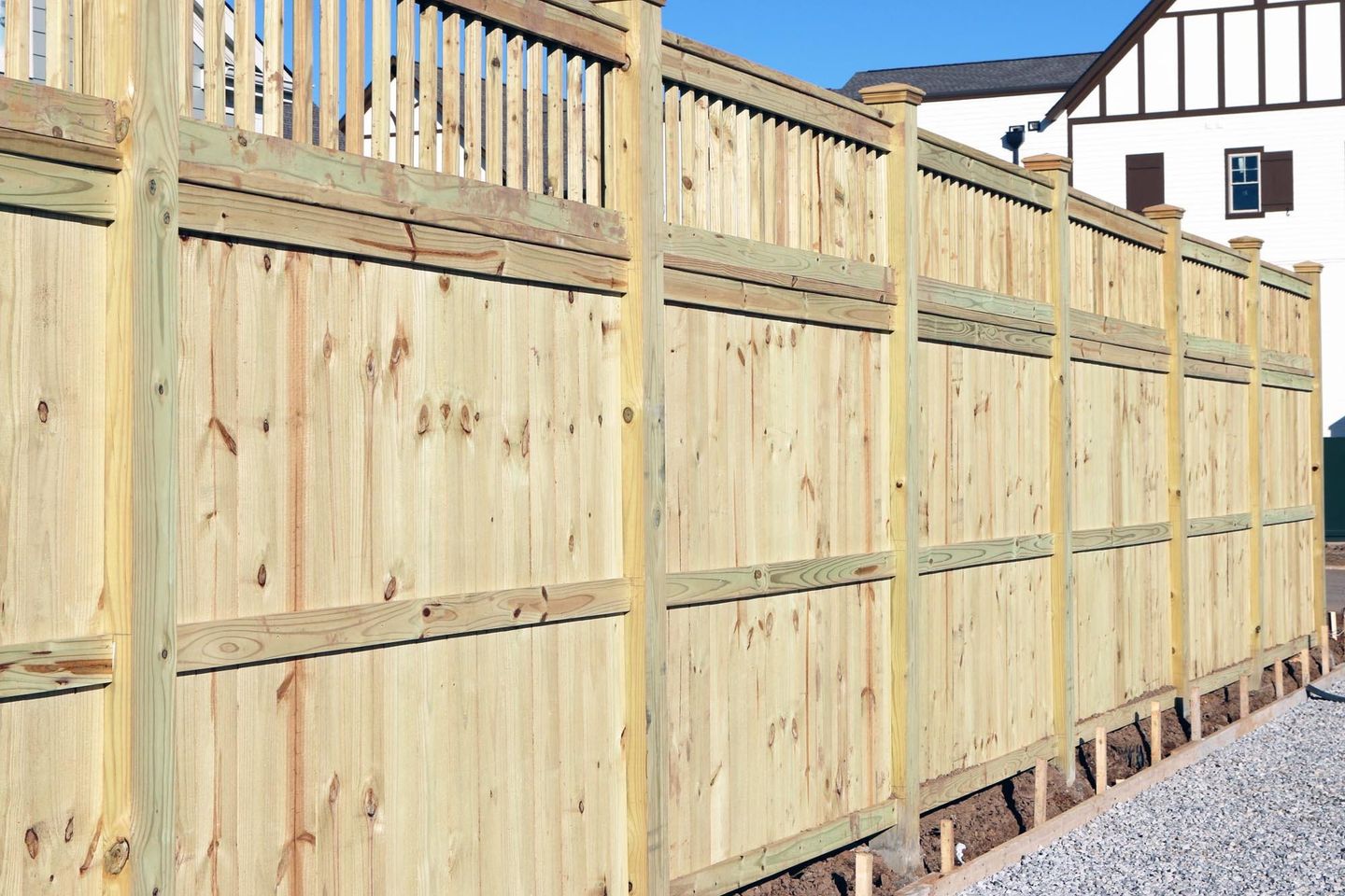 Quality white fence running along the customer property  in Nelson