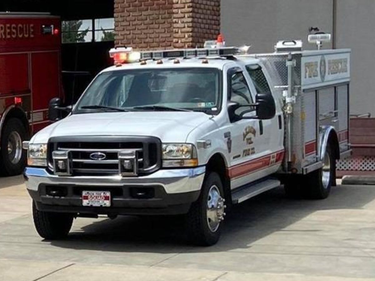 Akron's Squad 12-1  vehicle parked in front of the fire station.