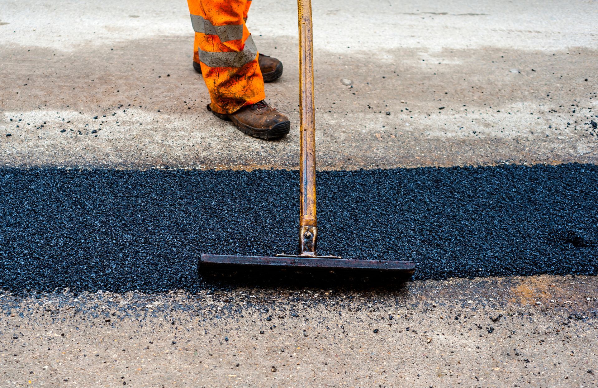 Construction worker during asphalting road works.