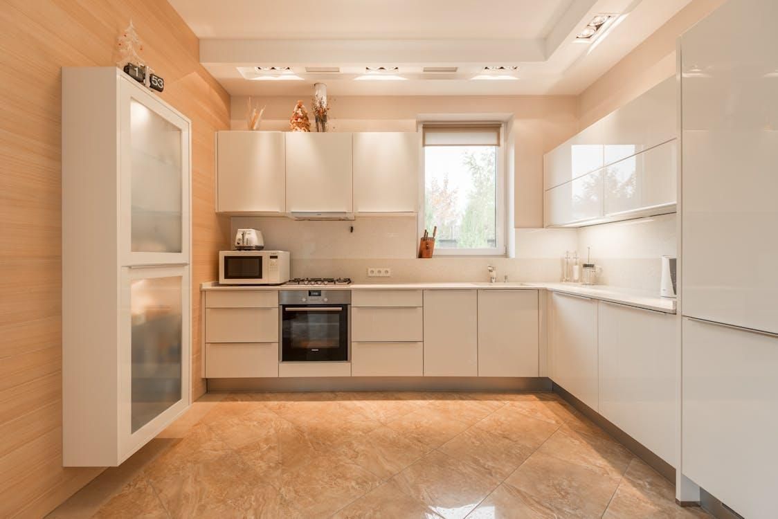 Modern kitchen in Bozeman, MT, with restored tile floors and clean grout lines after professional cl