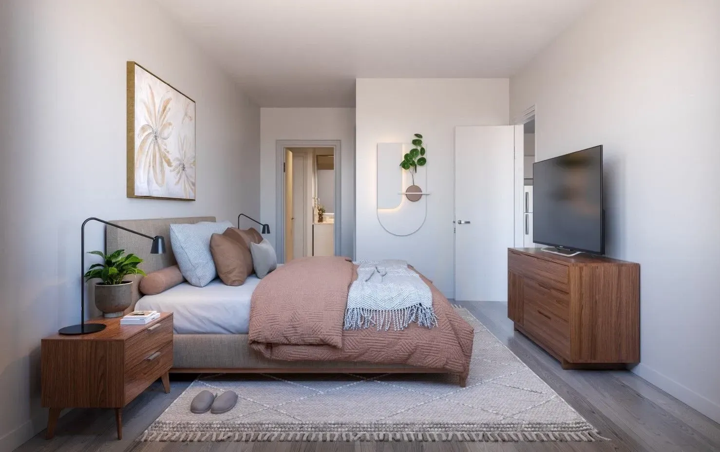 Bedroom in a modern apartment with a bed, a wood nightstand, plant, and a TV on a dresser.