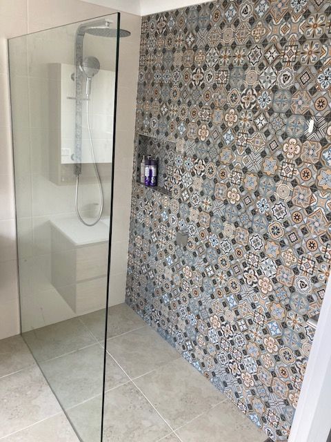 A Bathroom With a Walk in Shower and a Bathtub — Patterson Glass Works in Kempsey, NSW