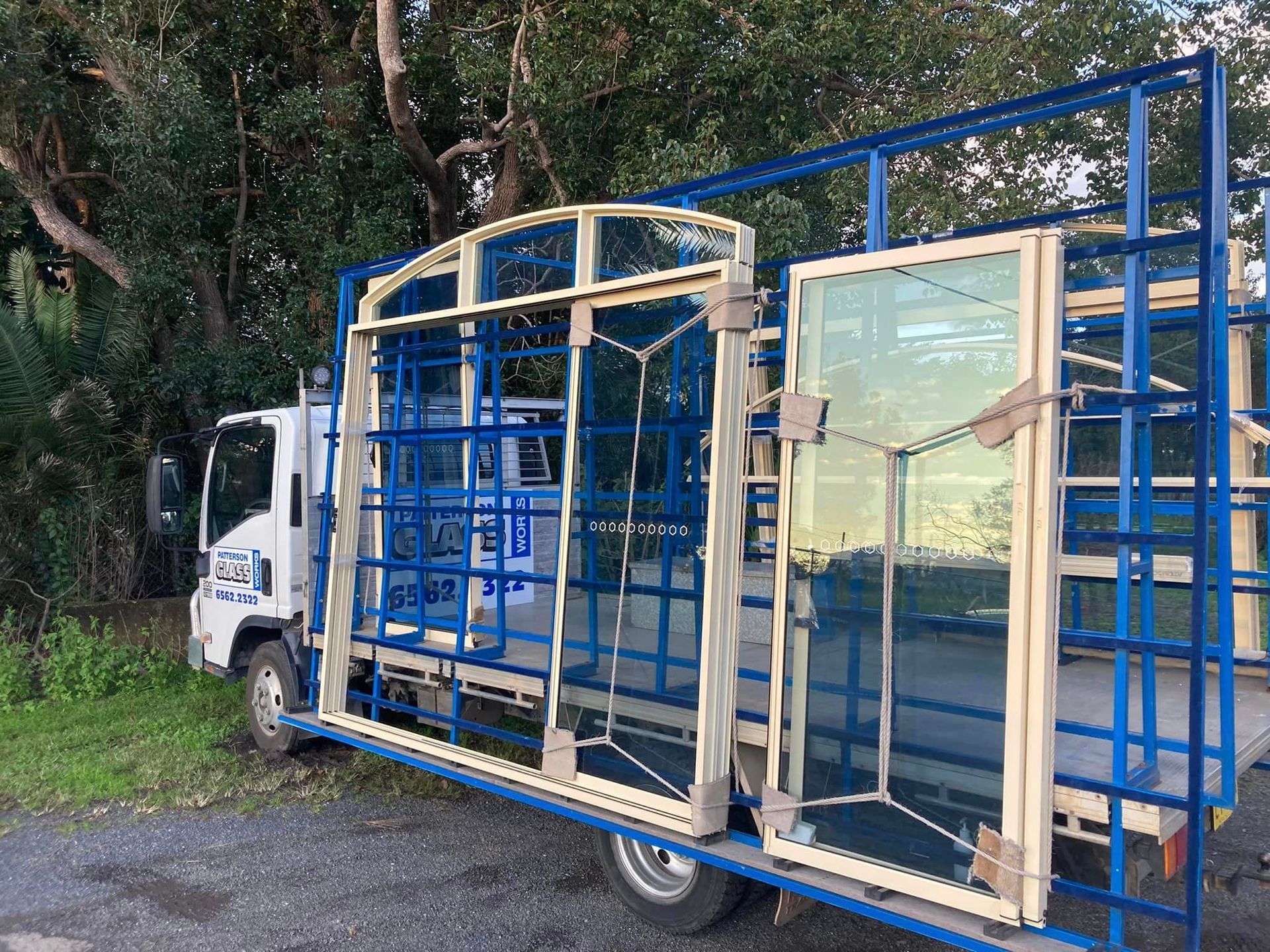 Truck carrying glass frame— Patterson Glass Works in Kempsey, NSW