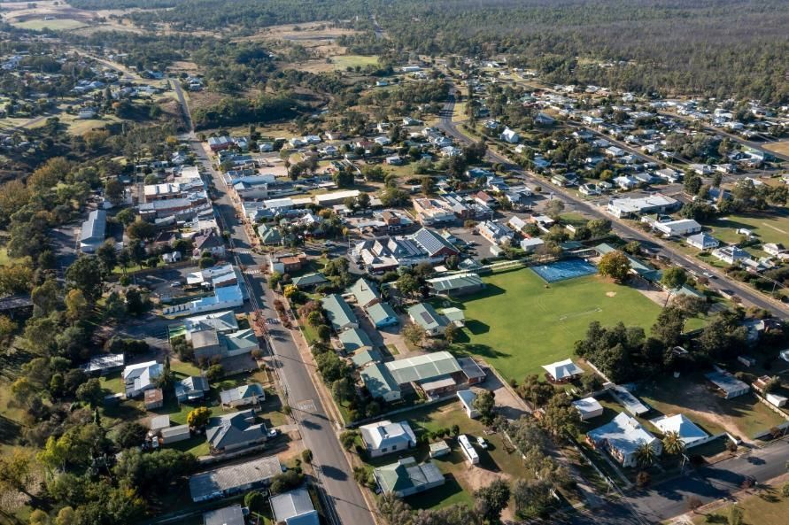 An Aerial View of a Small Town With Lots of Houses and Trees — Patterson Glass Works in Frederickton, NSW
