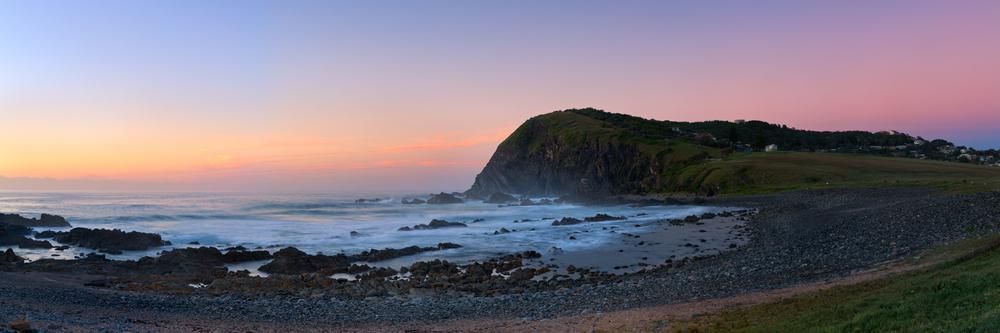 A Panoramic View of a Cliff Overlooking the Ocean at Sunset — Patterson Glass Works in Crescent Head, NSW